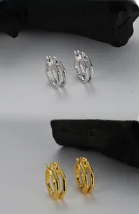 Detail of S925 sterling silver hollow double-layer hexagonal geometric hoop earrings