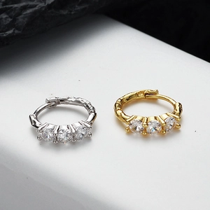 Textured S925 sterling silver huggie earrings with three sparkling stones in gold and silver