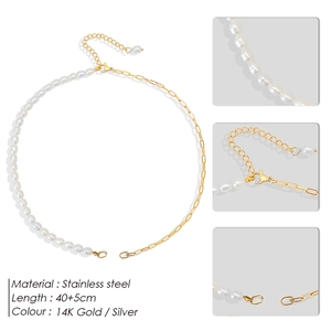 Detail of asymmetrical stainless steel necklace with white pearls and 40+5cm adjustable chain