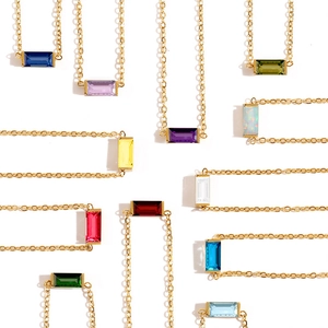 Gold chain bracelets featuring colorful rectangular zirconia stones in multiple vibrant colors