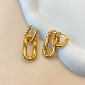 Gold-plated stainless steel link earrings with textured oval chain on white stone tray