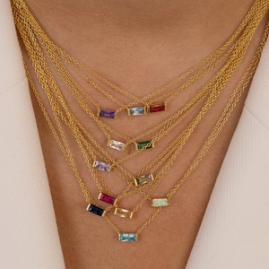 Minimalist gold necklace with colorful rectangular birthstone pendant for layered style