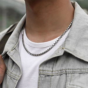 Minimalist silver-toned stainless steel box chain necklace for men shown on a model