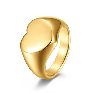 Detailed view of heart-shaped gold-plated signet ring with polished finish