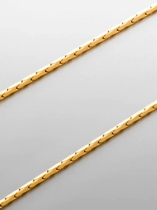 Macro detail of high-polish 18K gold-plated stainless steel snake chain necklace for men
