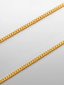Close-up of highly polished 18K gold-plated stainless steel Cuban link necklace