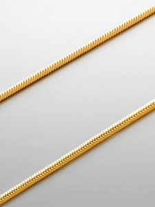 Macro shot of 18K gold plated stainless steel snake chain showing its smooth polished links