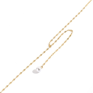 Close-up of gold-plated twisted chain necklace with a round white pearl pendant detail