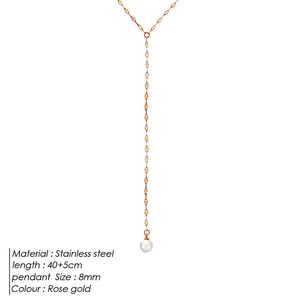 Detail showing rose gold stainless steel Y-necklace with an 8mm pearl pendant