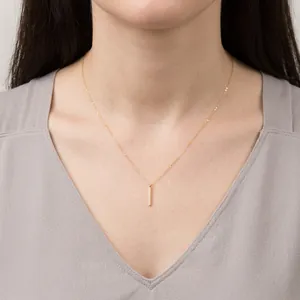 Minimalist gold bar pendant necklace with sleek rectangular vertical drop and O-chain