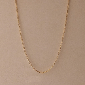 Close-up of a 14k gold plated stainless steel paperclip chain necklace with sleek finish