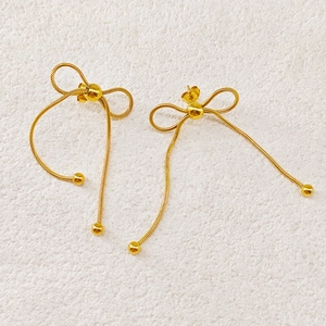 Elegant gold bowknot drop earrings in stainless steel with long snake chain tassels