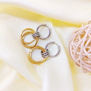 Minimalist stainless steel two-tone 18K gold intertwined circle hoop earrings for women