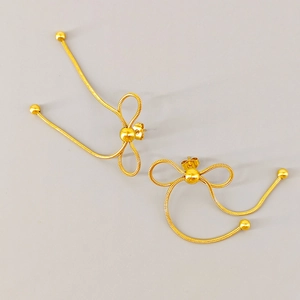Elegant gold bow-knot drop earrings in stainless steel with a polished woven texture finish