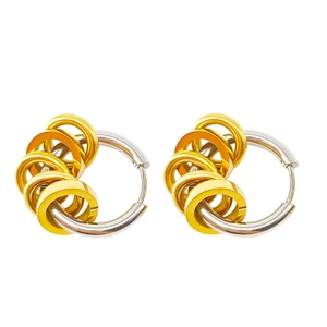 Minimalist silver hoop earrings with five gold charms in a two-tone stainless steel style
