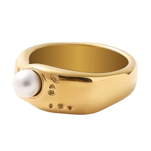 Baroque style gold liquid lava ring with white pearl on a clean white background
