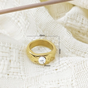 Detailed macro view of liquid lava gold ring with 4mm pearl and hammer texture
