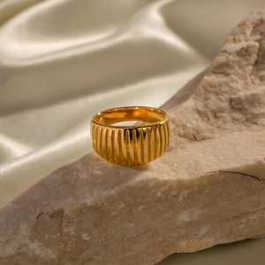 French vintage 18k gold plated ribbed stainless steel ring on a natural stone base
