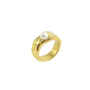 Detail of gold liquid lava textured ring with a white baroque pearl and hammered finish