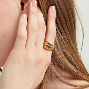 Polished gold croissant dome ring featuring unique vertical ribbed texture for women