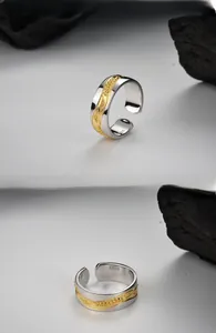 Detail of S925 silver ring featuring golden wheat ear texture and material hallmark