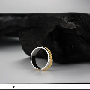 Macro view of adjustable S925 silver ring featuring golden wheat ear relief texture