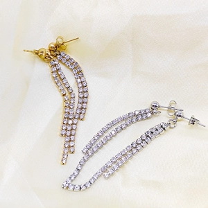 Macro detail of long tassel earrings with double rows of sparkling cubic zirconia stones