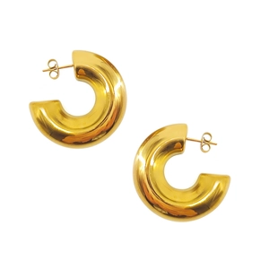 Macro view of chunky 18K gold plated stainless steel C-shaped earrings with mirror polish