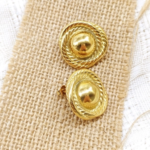 Detail of vintage dome stud earrings with twisted rope texture and 18K gold finish