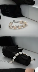 Detail of double-strand baroque pearl bracelet with silver beads and lobster clasp