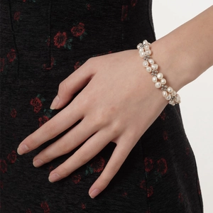 Elegant double-layer S925 sterling silver bracelet with baroque pearls on a woman's wrist