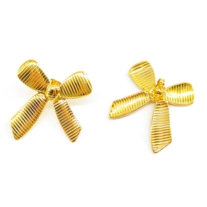 Polished 18k gold plated stainless steel bow stud earrings with textured stripe details