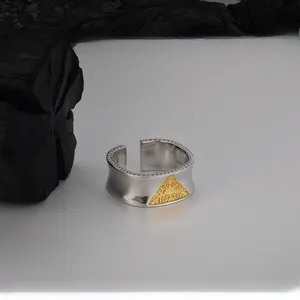 Detail of S925 silver ring with golden triangle relief and vintage baroque patterns