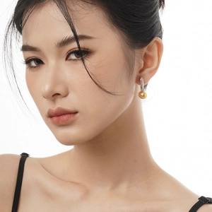S925 sterling silver drop earrings featuring textured silver hooks and golden pearls