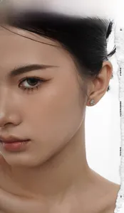 Close-up of S925 silver Saturn stud earring with white agate on a female model