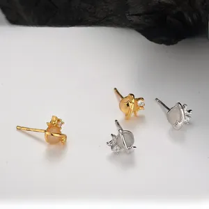 Close-up of S925 silver Saturn stud earrings with white agate and sparkling stones
