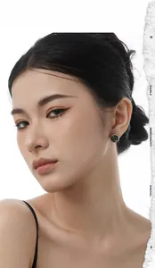 Close-up of S925 sterling silver stud earring with black shell inlay on a model