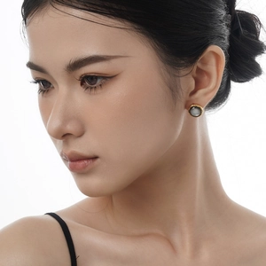 S925 silver stud earrings with gradient shell inlay and gold rim shown on model