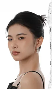 Close-up of elegant S925 silver flower earrings with cascading pearls on a model