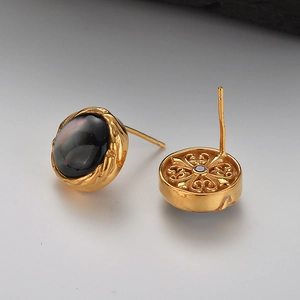 S925 silver stud earrings featuring black shell inlay and ornate floral hollow engraving