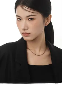 Close-up of minimalist gold plated S925 sterling silver chain necklace on model