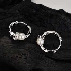 Elegant S925 sterling silver shell pearl earrings with irregular lava texture and zircons