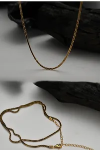 Detail of twisted gold chain with lobster clasp and adjustable extension on S925 silver