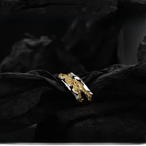 Artistic S925 silver lava-textured two-tone open ring on dark charcoal background
