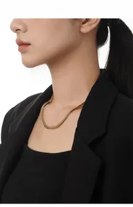 Close-up of minimalist flat snake chain necklace on model for professional daily wear