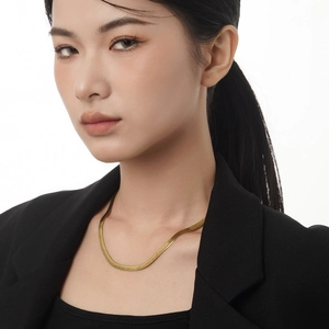 Minimalist S925 sterling silver flat herringbone chain necklace on model in black suit