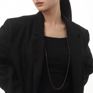 Minimalist long S925 sterling silver snake bone chain necklace in gold finish on model