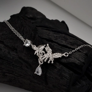 Lava texture S925 sterling silver butterfly necklace with teardrop zircon on charred wood