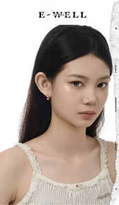 Close-up of polished S925 sterling silver geometric hoop earring on model with lace
