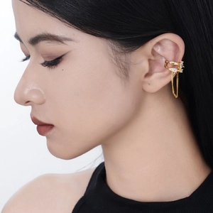 Elegant gold double-layered cuff earring with sparkling zircon stones and a long tassel chain